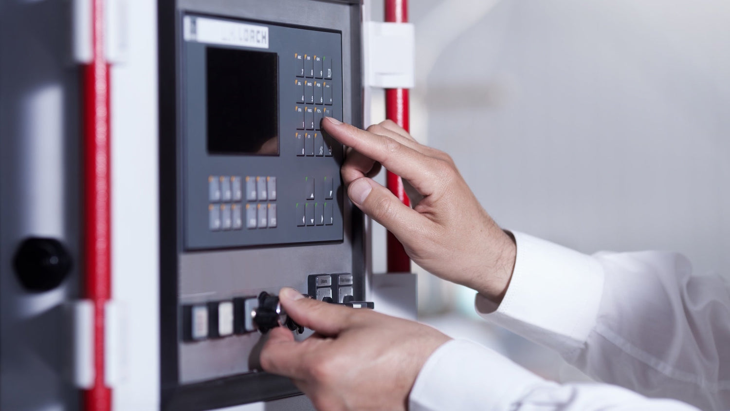 Professional staff programming filling equipment at the Aurora Lilot Factory.