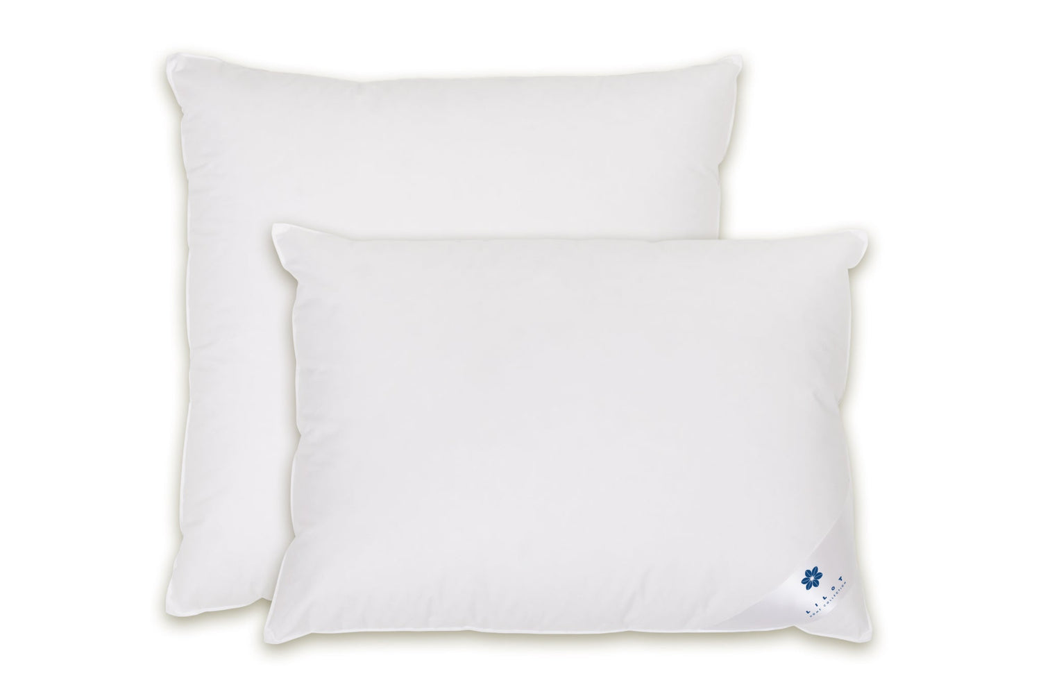 Two luxurious Aurora Lilot pillows on an elegant white background